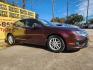 2012 Red /GRAY Ford Fusion (3FAHP0GAXCR) , located at 16710 Clay Rd., Houston, TX, 77084, (281) 859-7900, 29.834864, -95.656166 - Photo#2
