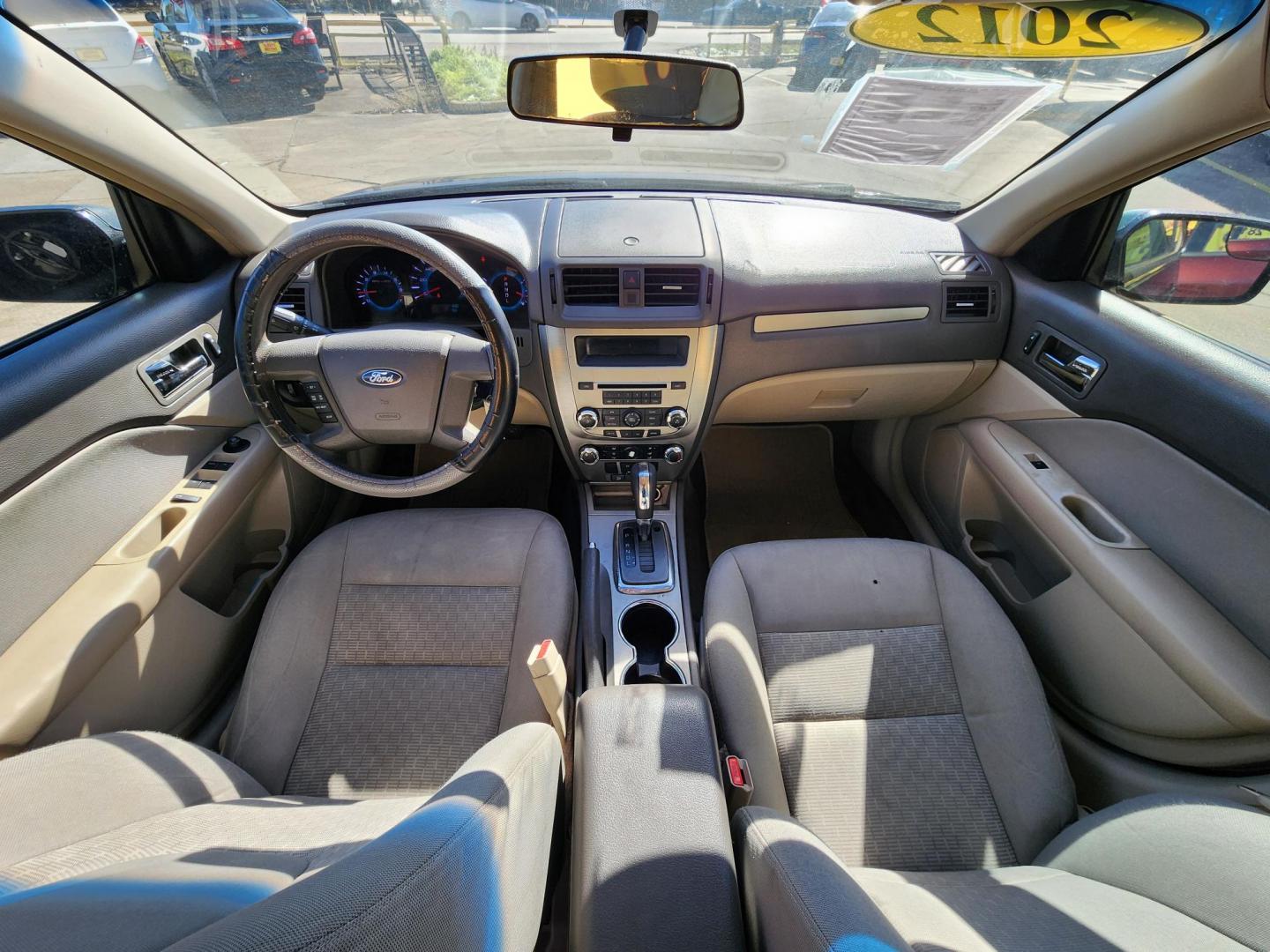 2012 Red /GRAY Ford Fusion (3FAHP0GAXCR) , located at 16710 Clay Rd., Houston, TX, 77084, (281) 859-7900, 29.834864, -95.656166 - Photo#7