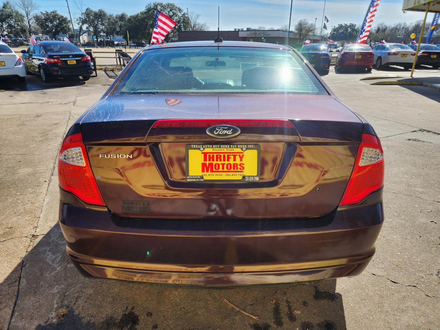 2012 Red /GRAY Ford Fusion (3FAHP0GAXCR) , located at 16710 Clay Rd., Houston, TX, 77084, (281) 859-7900, 29.834864, -95.656166 - Photo#5