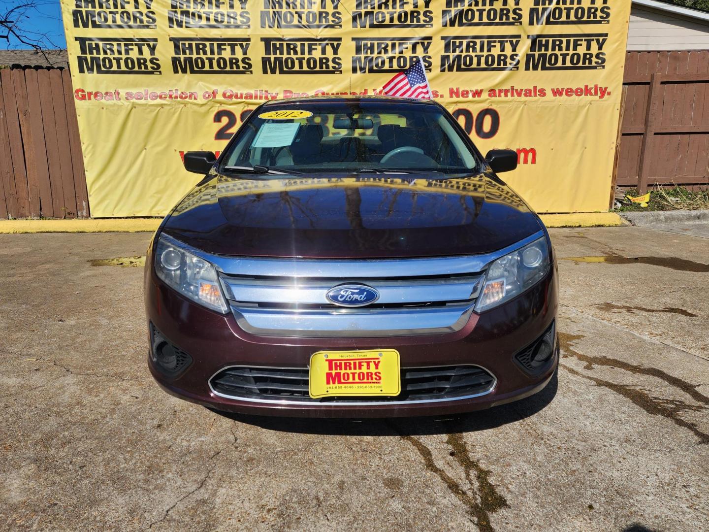 2012 Red /GRAY Ford Fusion (3FAHP0GAXCR) , located at 16710 Clay Rd., Houston, TX, 77084, (281) 859-7900, 29.834864, -95.656166 - Photo#0