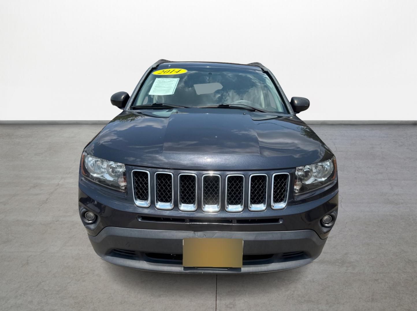 2014 Jeep Compass (1C4NJDBBXED) , located at 16710 Clay Rd., Houston, TX, 77084, (281) 859-7900, 29.834864, -95.656166 - Photo#1