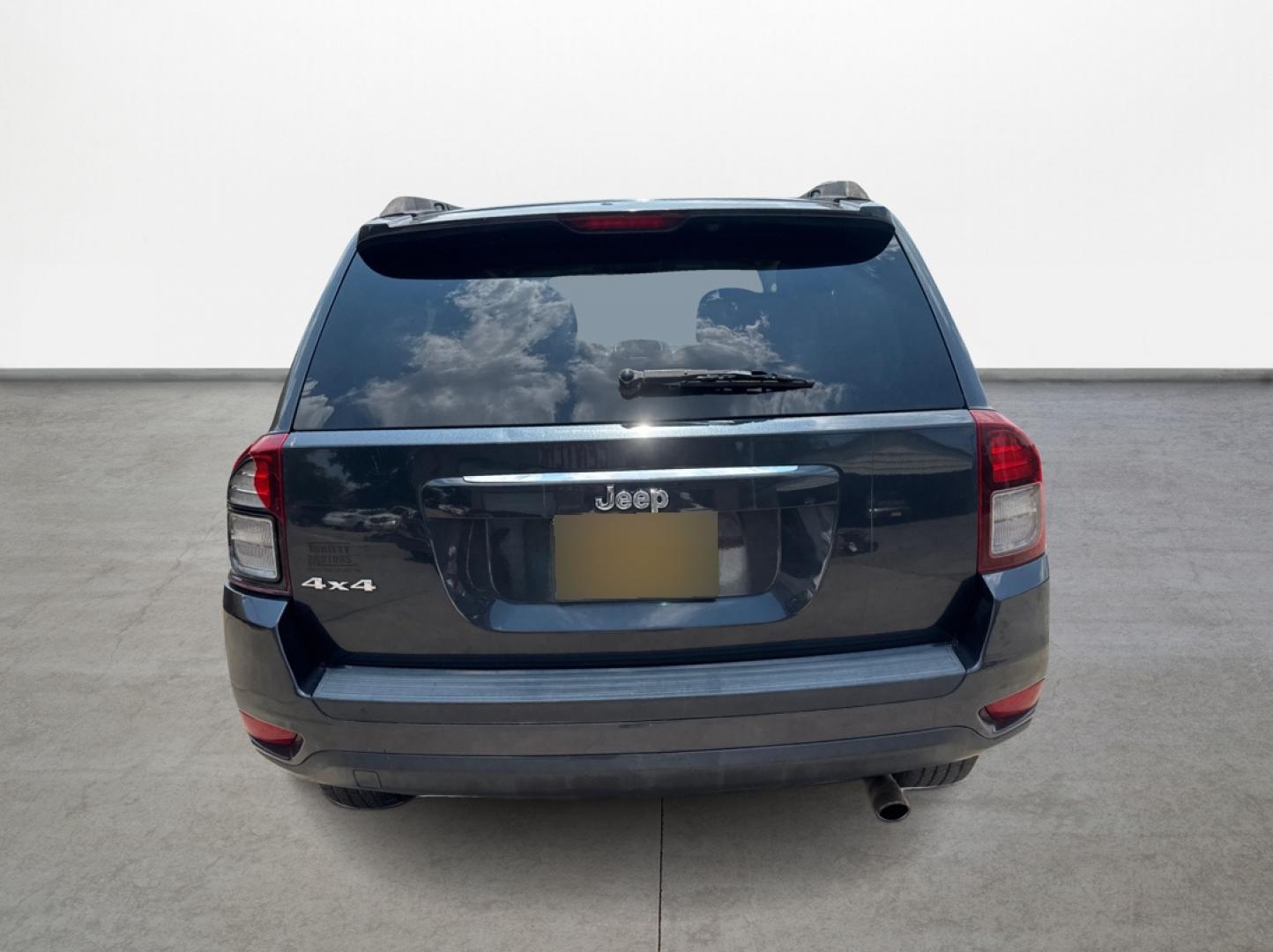 2014 Jeep Compass (1C4NJDBBXED) , located at 16710 Clay Rd., Houston, TX, 77084, (281) 859-7900, 29.834864, -95.656166 - Photo#5