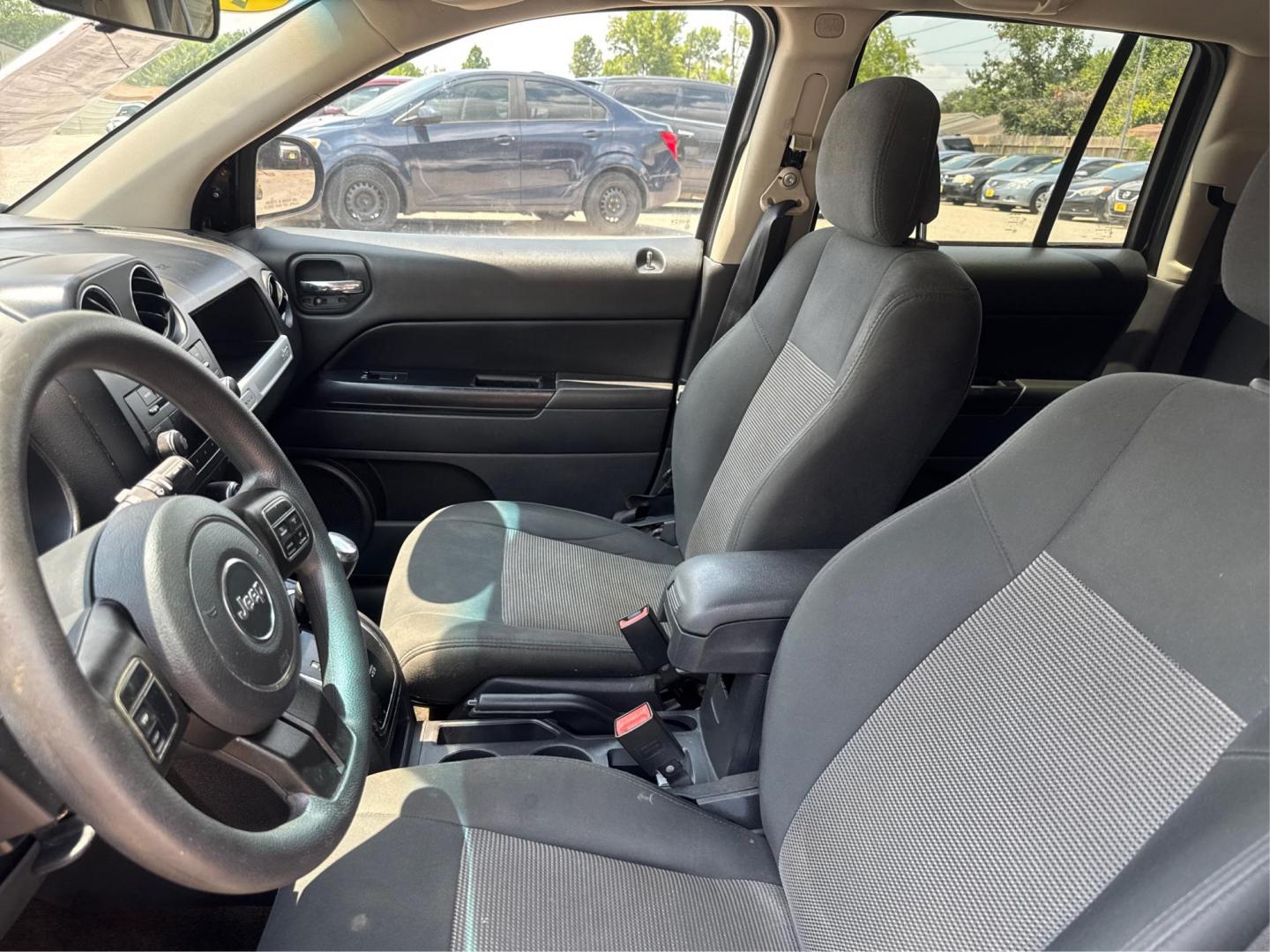 2014 Jeep Compass (1C4NJDBBXED) , located at 16710 Clay Rd., Houston, TX, 77084, (281) 859-7900, 29.834864, -95.656166 - Photo#13