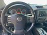 2012 Nissan Titan (1N6BA0ED2CN) , located at 16710 Clay Rd., Houston, TX, 77084, (281) 859-7900, 29.834864, -95.656166- Photo#8