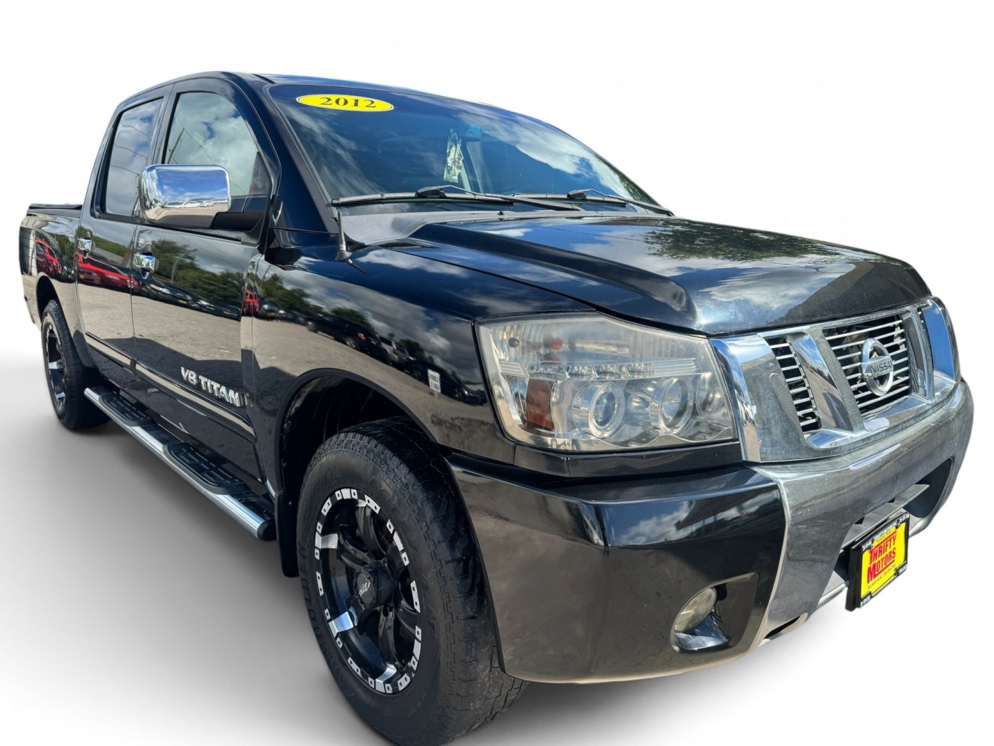 2012 Nissan Titan (1N6BA0ED2CN) , located at 16710 Clay Rd., Houston, TX, 77084, (281) 859-7900, 29.834864, -95.656166- Photo#0