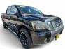 2012 Nissan Titan (1N6BA0ED2CN) , located at 16710 Clay Rd., Houston, TX, 77084, (281) 859-7900, 29.834864, -95.656166- Photo#0
