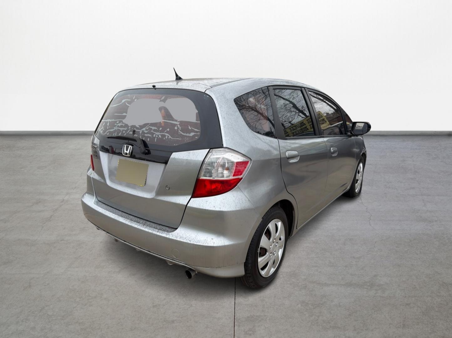 2009 Honda Fit 5-Speed AT (JHMGE882X9S) with an 1.5L L4 SOHC 16V engine, 5-Speed Automatic transmission, located at 16710 Clay Rd., Houston, TX, 77084, (281) 859-7900, 29.834864, -95.656166 - Photo#4