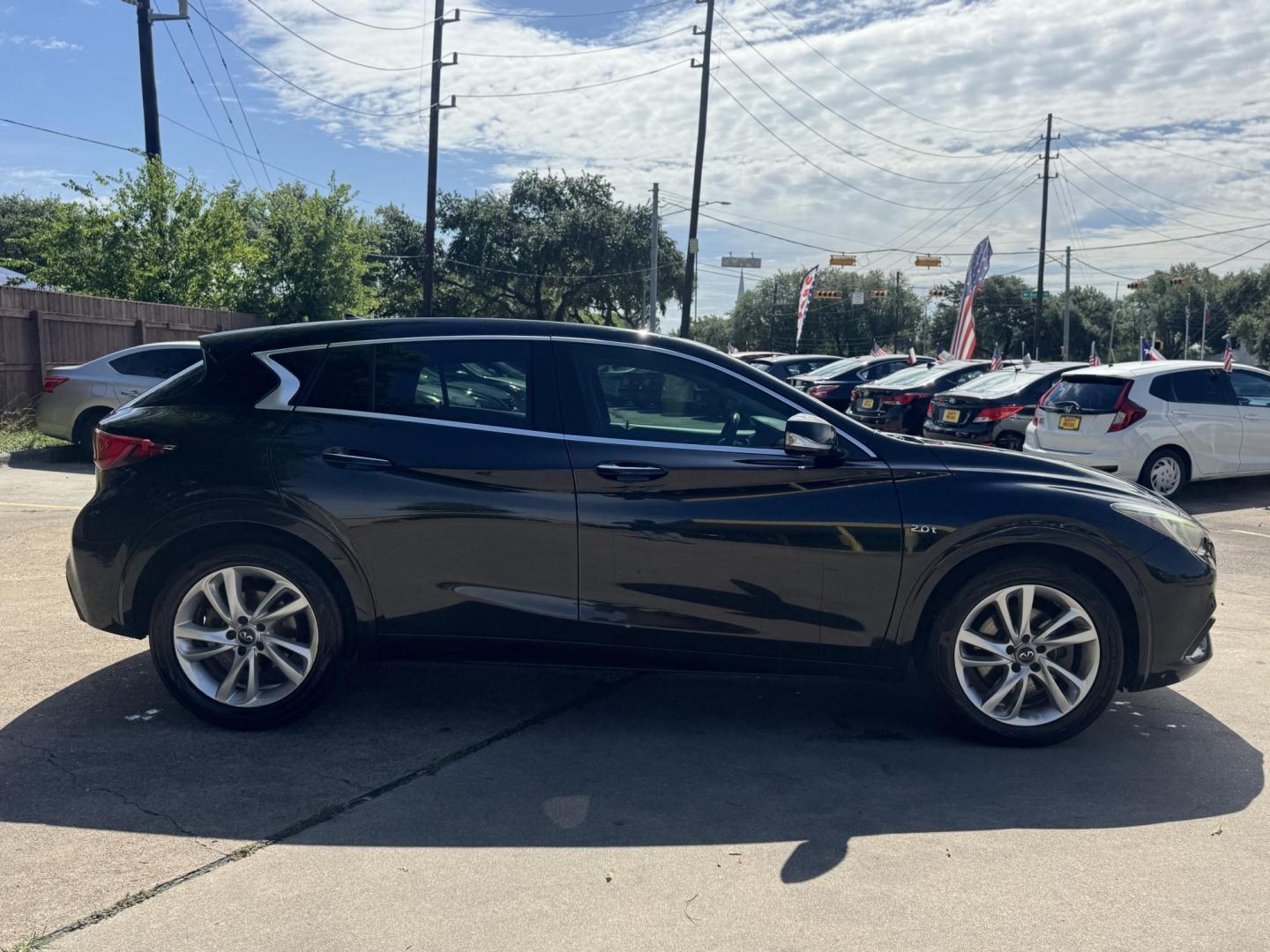 2017 Black /Black Infiniti QX30 (SJKCH5CP2HA) , located at 16710 Clay Rd., Houston, TX, 77084, (281) 859-7900, 29.834864, -95.656166 - Photo#9