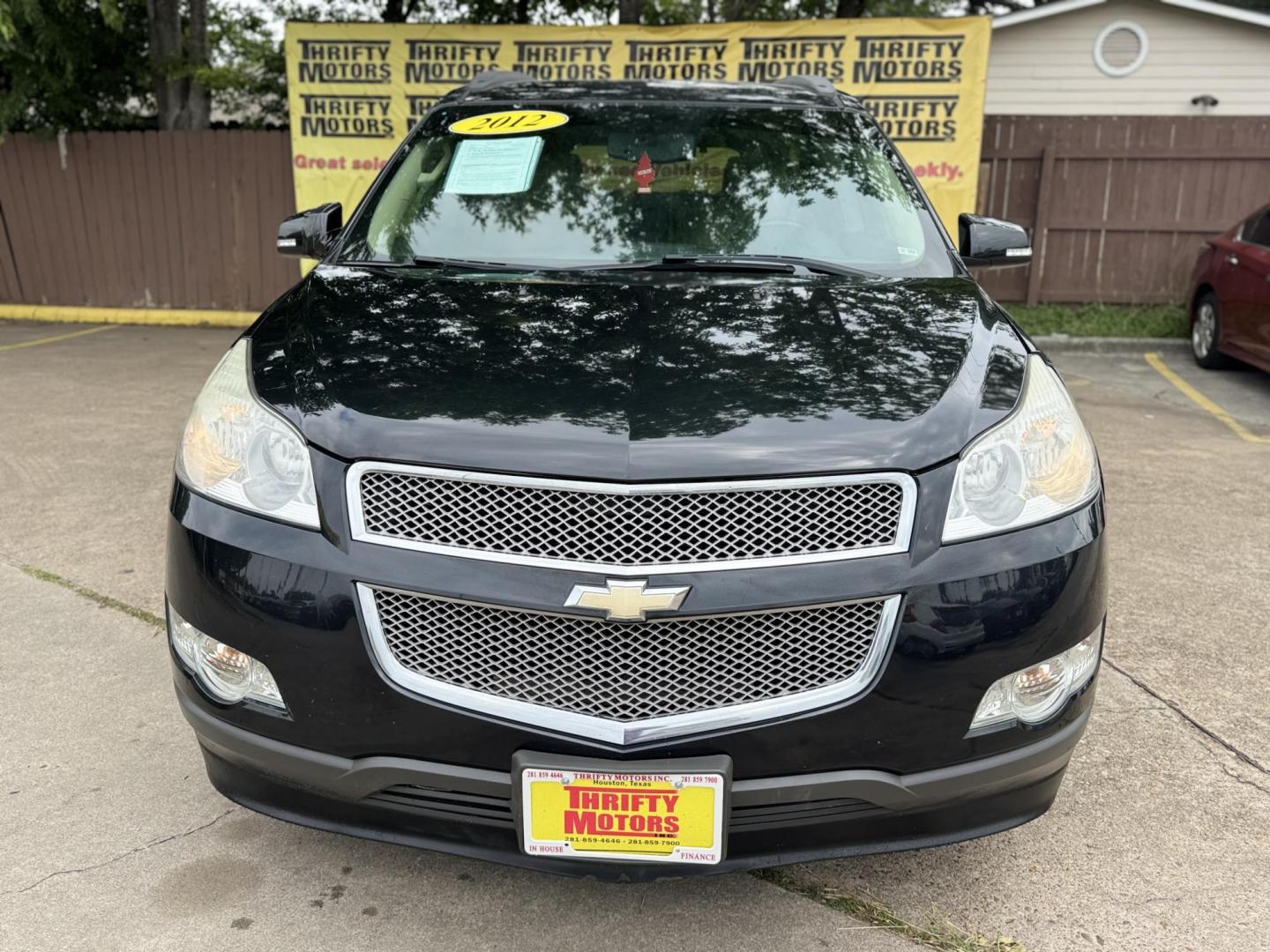 2012 Black /Beige Chevrolet Traverse (1GNKRLED3CJ) , located at 16710 Clay Rd., Houston, TX, 77084, (281) 859-7900, 29.834864, -95.656166 - Photo#0