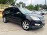 2012 Black /Beige Chevrolet Traverse (1GNKRLED3CJ) , located at 16710 Clay Rd., Houston, TX, 77084, (281) 859-7900, 29.834864, -95.656166 - Photo#2