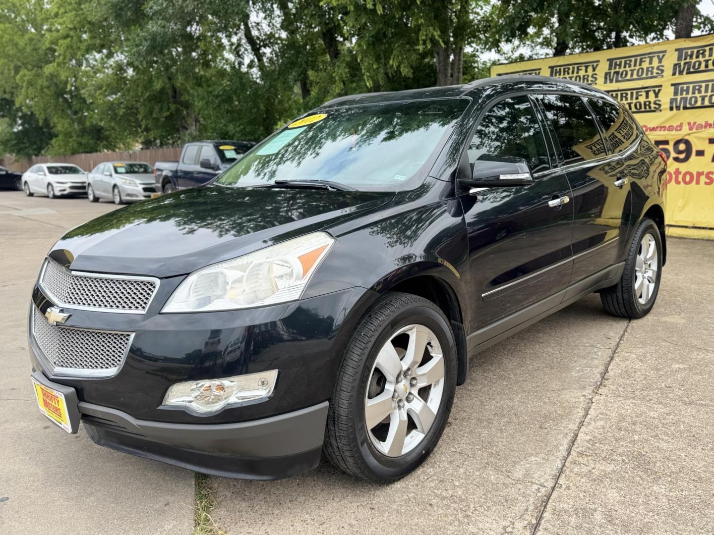 2012 Black /Beige Chevrolet Traverse (1GNKRLED3CJ) , located at 16710 Clay Rd., Houston, TX, 77084, (281) 859-7900, 29.834864, -95.656166 - Photo#1