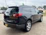 2012 Black /Beige Chevrolet Traverse (1GNKRLED3CJ) , located at 16710 Clay Rd., Houston, TX, 77084, (281) 859-7900, 29.834864, -95.656166 - Photo#4