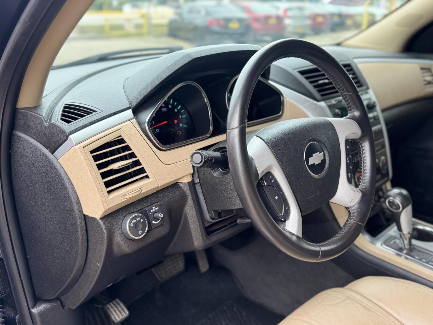2012 Black /Beige Chevrolet Traverse (1GNKRLED3CJ) , located at 16710 Clay Rd., Houston, TX, 77084, (281) 859-7900, 29.834864, -95.656166 - Photo#8