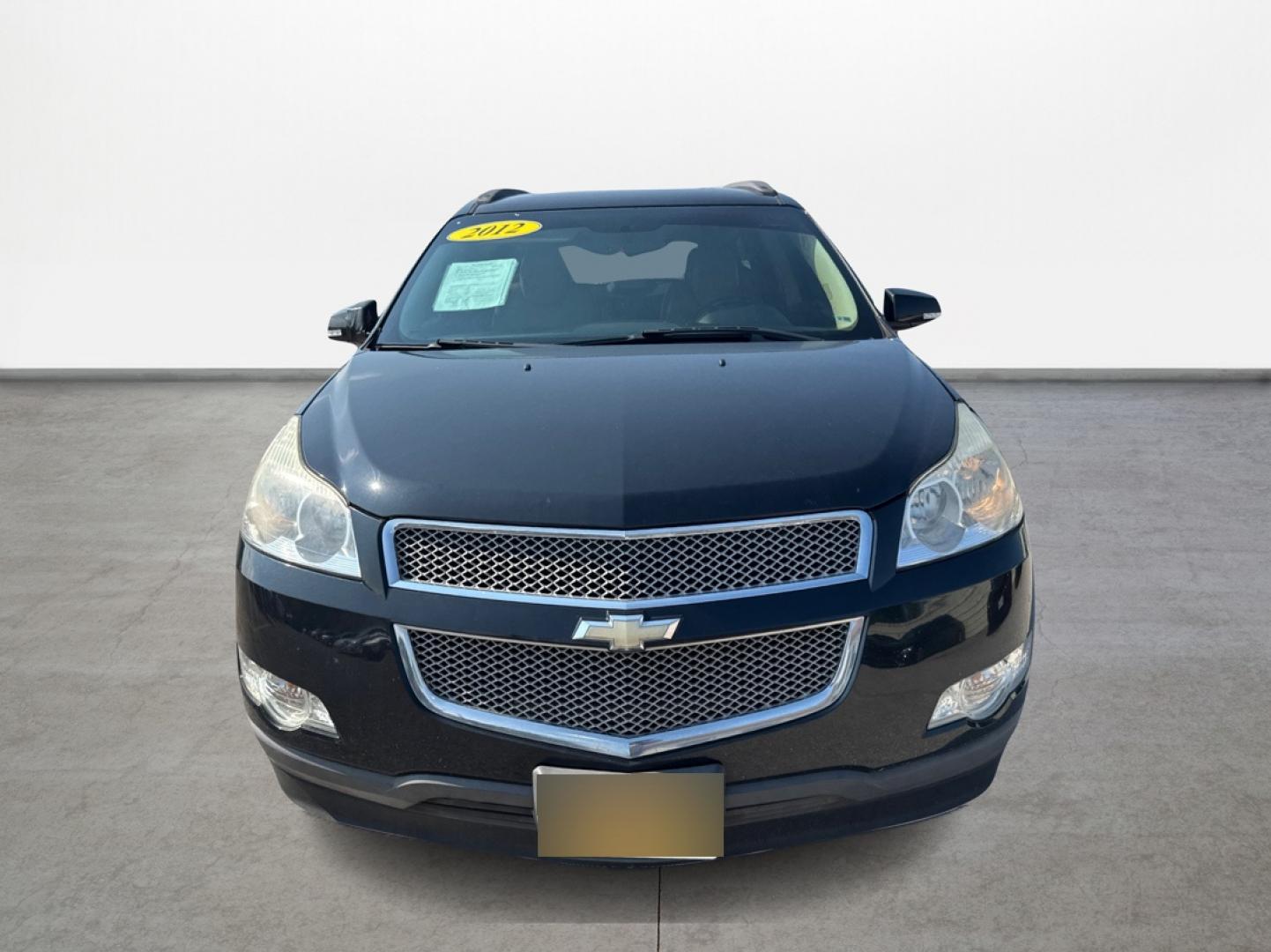2012 Black /Beige Chevrolet Traverse (1GNKRLED3CJ) , located at 16710 Clay Rd., Houston, TX, 77084, (281) 859-7900, 29.834864, -95.656166 - Photo#1