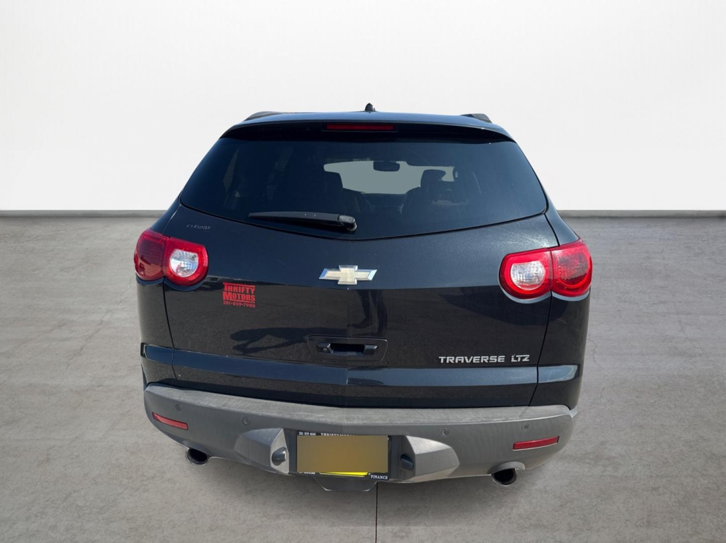 2012 Black /Beige Chevrolet Traverse (1GNKRLED3CJ) , located at 16710 Clay Rd., Houston, TX, 77084, (281) 859-7900, 29.834864, -95.656166 - Photo#5