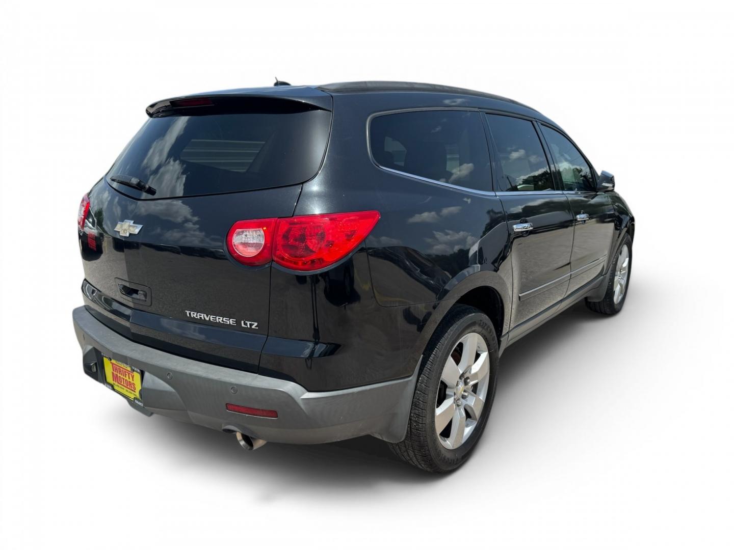 2012 Black /Beige Chevrolet Traverse (1GNKRLED3CJ) , located at 16710 Clay Rd., Houston, TX, 77084, (281) 859-7900, 29.834864, -95.656166- Photo#5