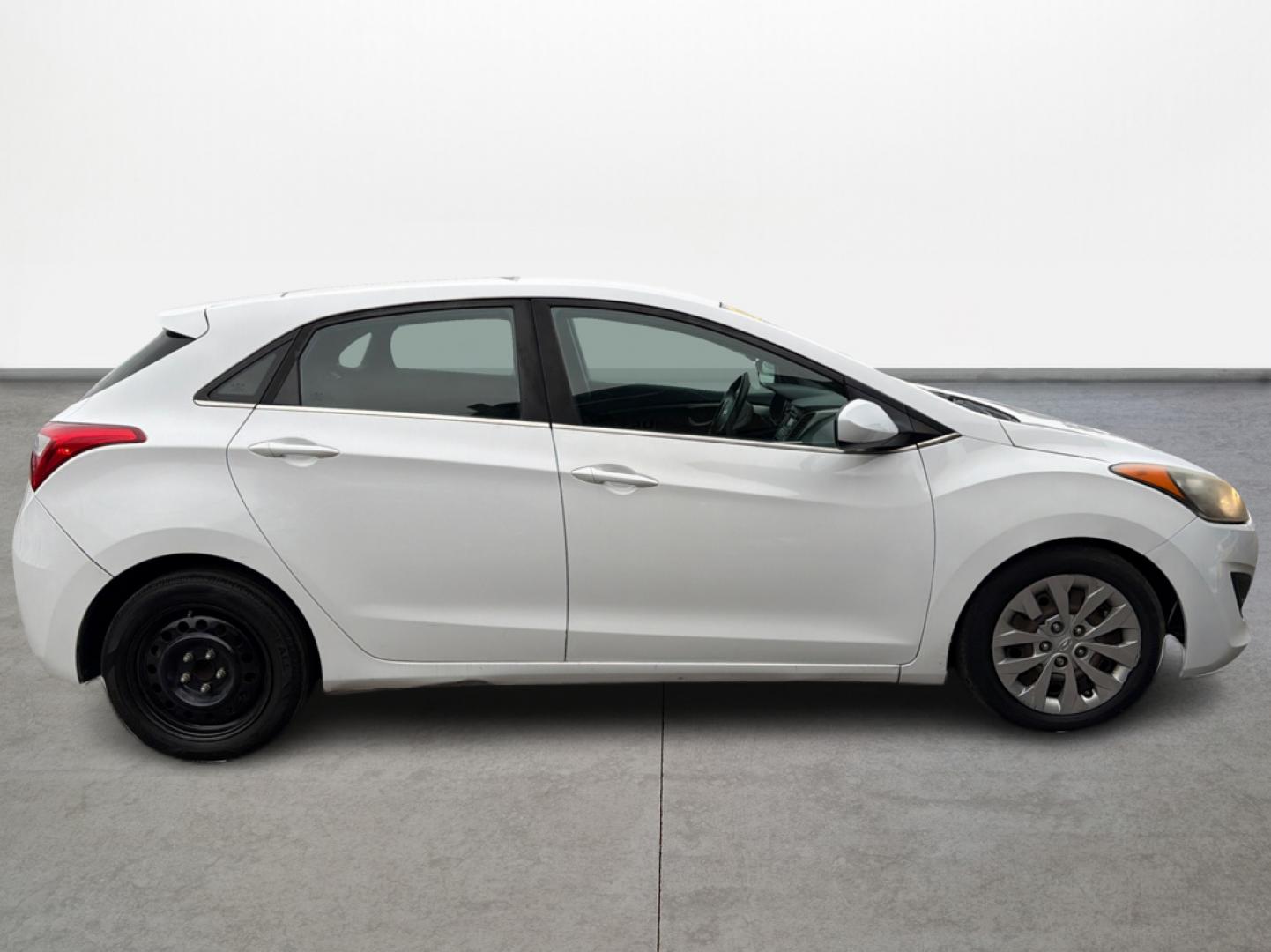 2017 White /Black Hyundai Elantra GT M/T (KMHD35LH7HU) with an 2.0L L4 16V DOHC engine, 6M transmission, located at 16710 Clay Rd., Houston, TX, 77084, (281) 859-7900, 29.834864, -95.656166 - Photo#7