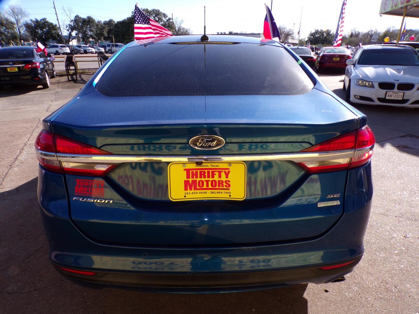 2018 Blue /Gray Ford Fusion SE (3FA6P0HD4JR) with an 1.5L L4 DOHC 16V engine, 6A transmission, located at 16710 Clay Rd., Houston, TX, 77084, (281) 859-7900, 29.834864, -95.656166 - Photo#5