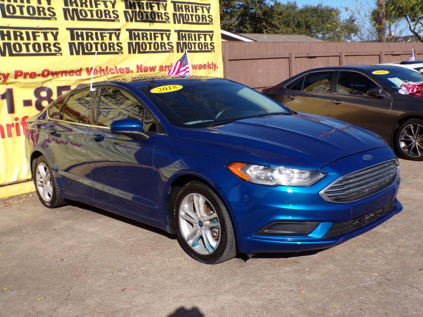 2018 Blue /Gray Ford Fusion SE (3FA6P0HD4JR) with an 1.5L L4 DOHC 16V engine, 6A transmission, located at 16710 Clay Rd., Houston, TX, 77084, (281) 859-7900, 29.834864, -95.656166 - Photo#2