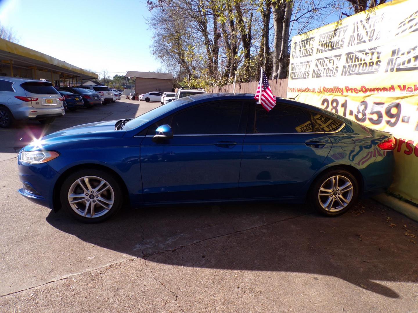2018 Blue /Gray Ford Fusion SE (3FA6P0HD4JR) with an 1.5L L4 DOHC 16V engine, 6A transmission, located at 16710 Clay Rd., Houston, TX, 77084, (281) 859-7900, 29.834864, -95.656166 - Photo#4