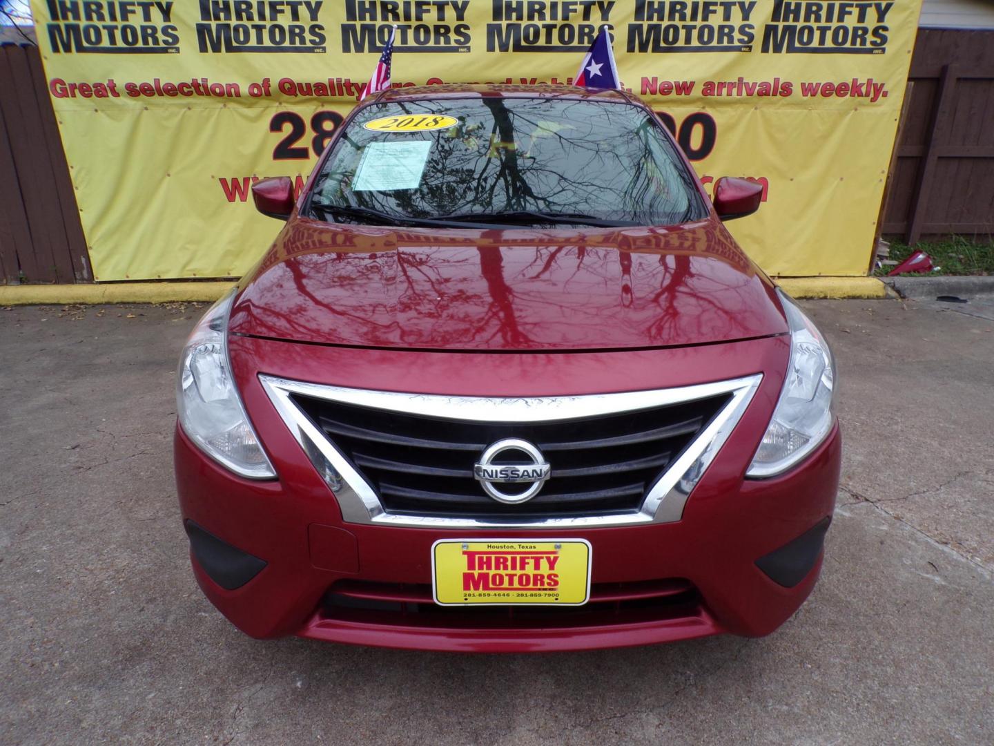 2018 Red /Gray Nissan Versa 1.6 SL Sedan (3N1CN7AP5JL) with an 1.6L L4 DOHC 16V engine, Automatic transmission, located at 16710 Clay Rd., Houston, TX, 77084, (281) 859-7900, 29.834864, -95.656166 - Photo#0
