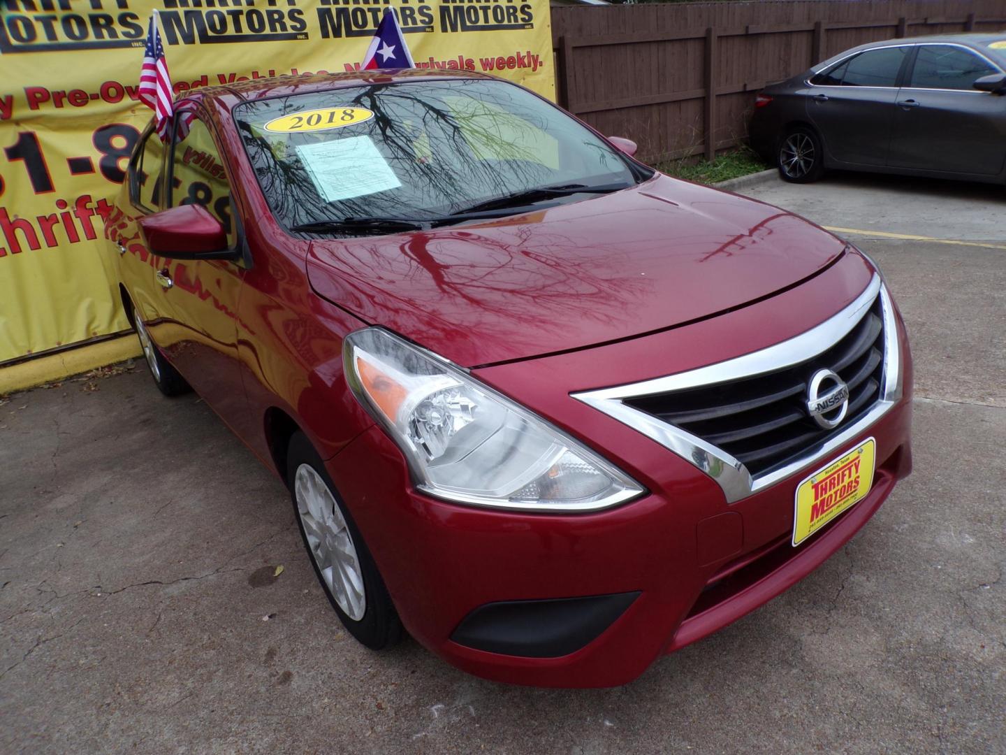 2018 Red /Gray Nissan Versa 1.6 SL Sedan (3N1CN7AP5JL) with an 1.6L L4 DOHC 16V engine, Automatic transmission, located at 16710 Clay Rd., Houston, TX, 77084, (281) 859-7900, 29.834864, -95.656166 - Photo#1