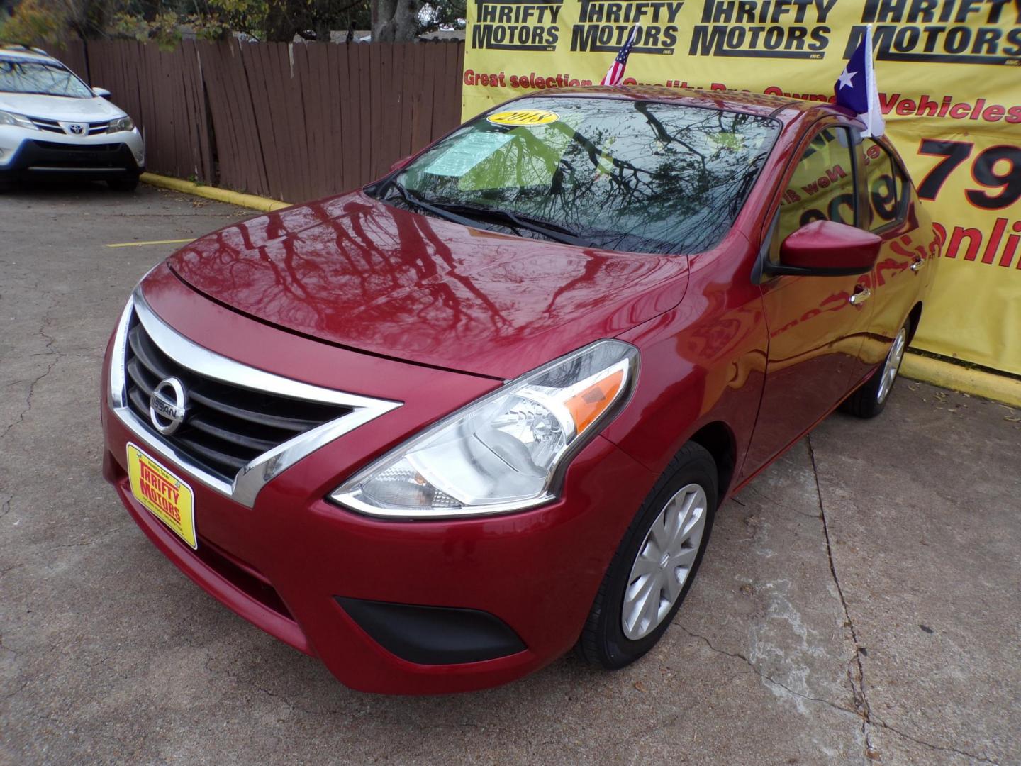 2018 Red /Gray Nissan Versa 1.6 SL Sedan (3N1CN7AP5JL) with an 1.6L L4 DOHC 16V engine, Automatic transmission, located at 16710 Clay Rd., Houston, TX, 77084, (281) 859-7900, 29.834864, -95.656166 - Photo#2