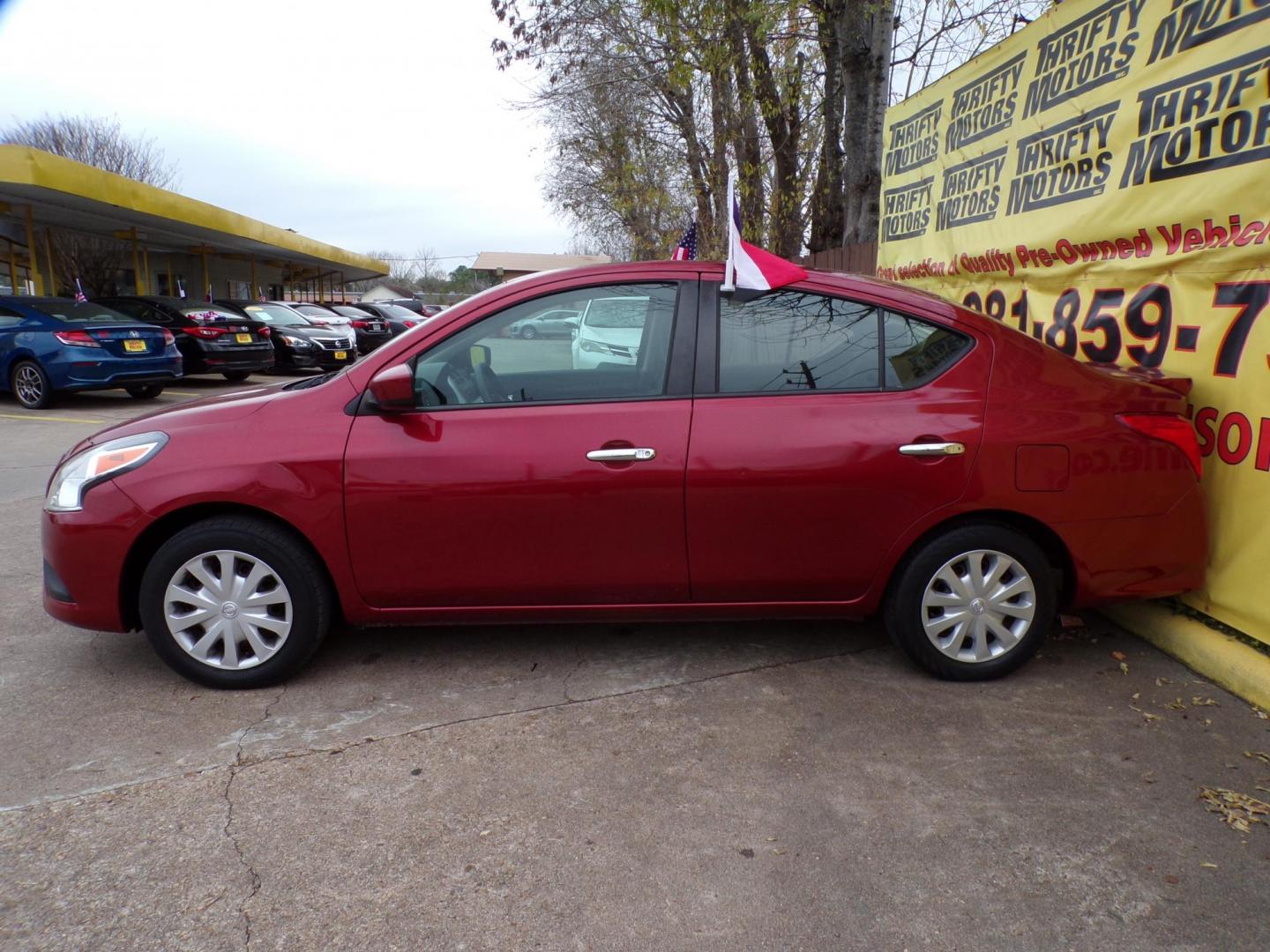 2018 Red /Gray Nissan Versa 1.6 SL Sedan (3N1CN7AP5JL) with an 1.6L L4 DOHC 16V engine, Automatic transmission, located at 16710 Clay Rd., Houston, TX, 77084, (281) 859-7900, 29.834864, -95.656166 - Photo#3