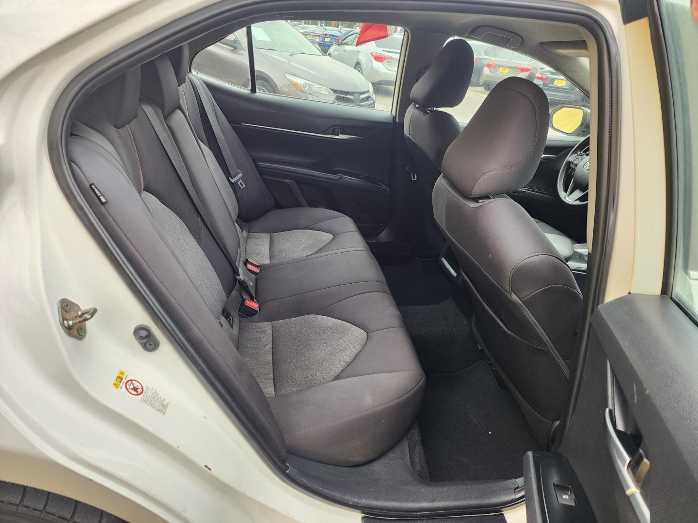 2019 White /Gray Toyota Camry LE (4T1B11HK2KU) with an 2.5L L4 DOHC 16V engine, Automatic 8-Speed transmission, located at 16710 Clay Rd., Houston, TX, 77084, (281) 859-7900, 29.834864, -95.656166 - Photo#12