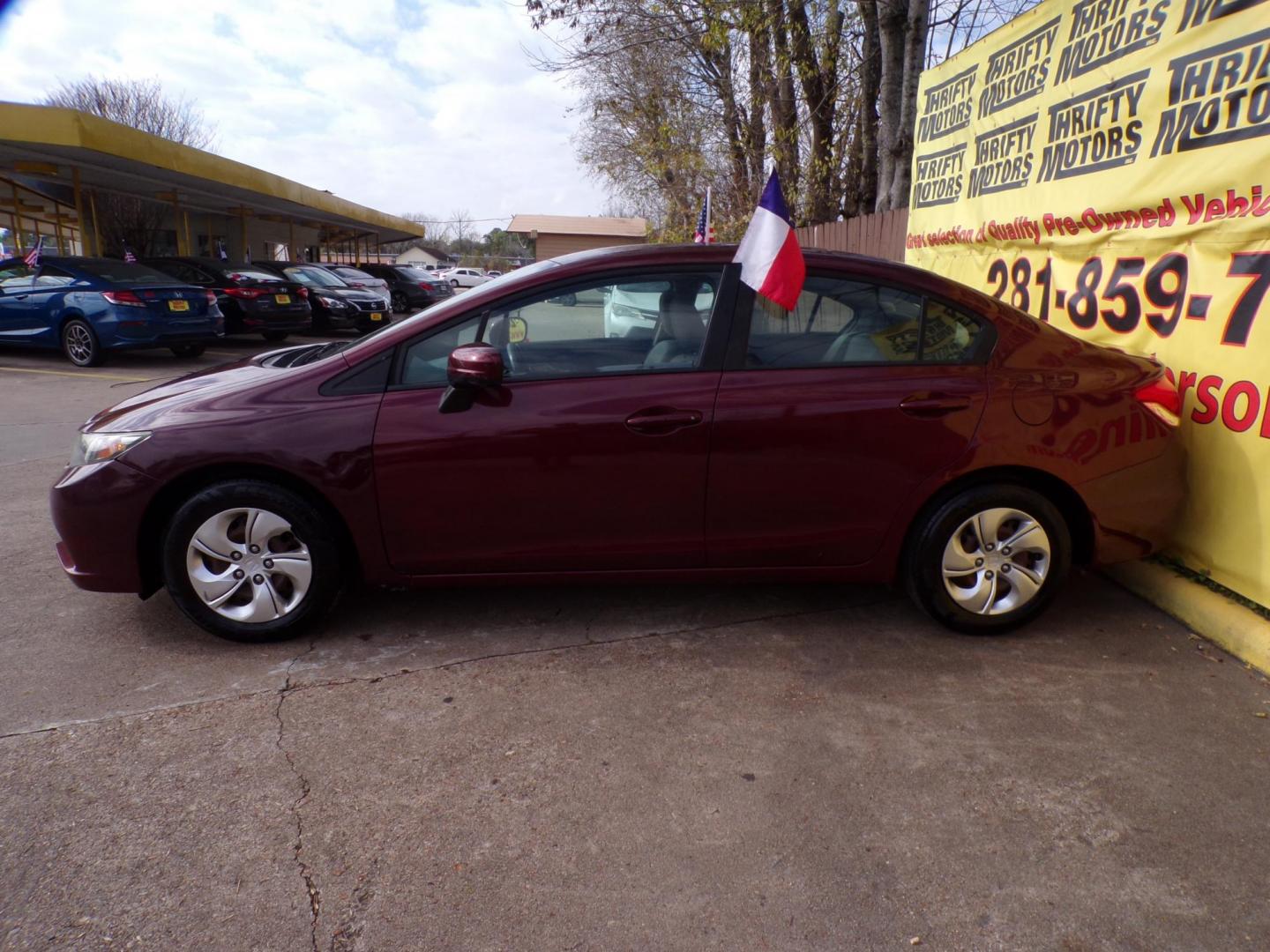 2015 Red /Gray Honda Civic LX Sedan CVT (19XFB2F54FE) with an 1.8L L4 SOHC 16V engine, Continuously Variable Transmission transmission, located at 16710 Clay Rd., Houston, TX, 77084, (281) 859-7900, 29.834864, -95.656166 - Photo#3