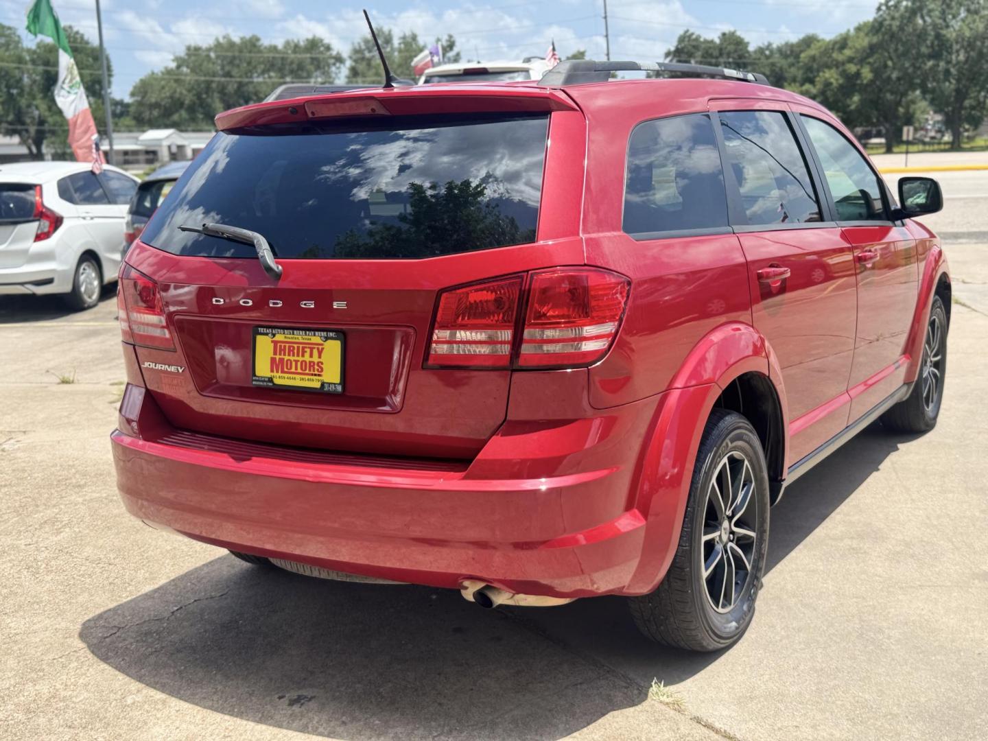 2018 Red /Black Dodge Journey SE (3C4PDCAB0JT) with an 2.4L L4 DOHC 16V engine, Automatic transmission, located at 16710 Clay Rd., Houston, TX, 77084, (281) 859-7900, 29.834864, -95.656166 - Photo#31
