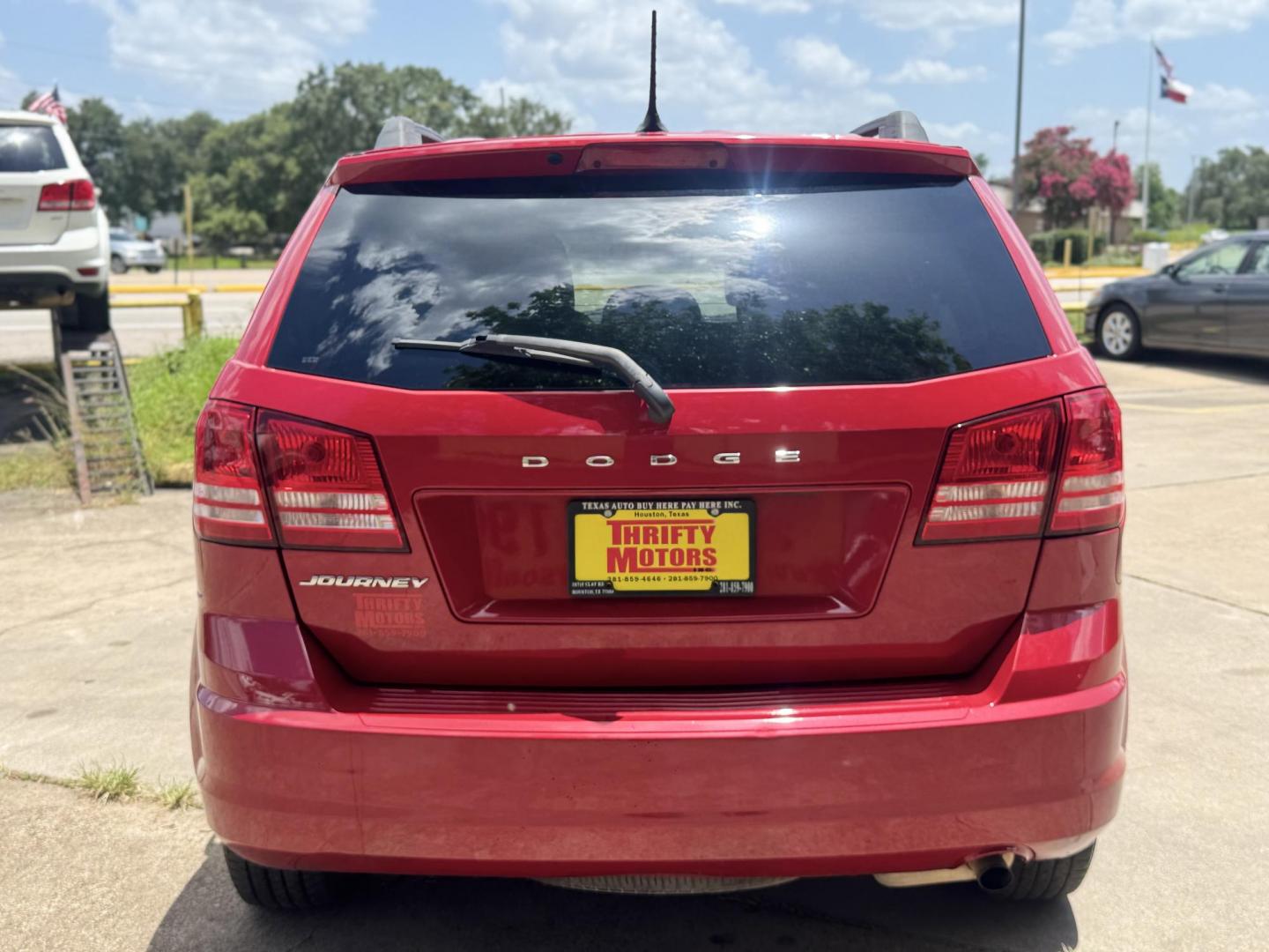 2018 Red /Black Dodge Journey SE (3C4PDCAB0JT) with an 2.4L L4 DOHC 16V engine, Automatic transmission, located at 16710 Clay Rd., Houston, TX, 77084, (281) 859-7900, 29.834864, -95.656166 - Photo#34