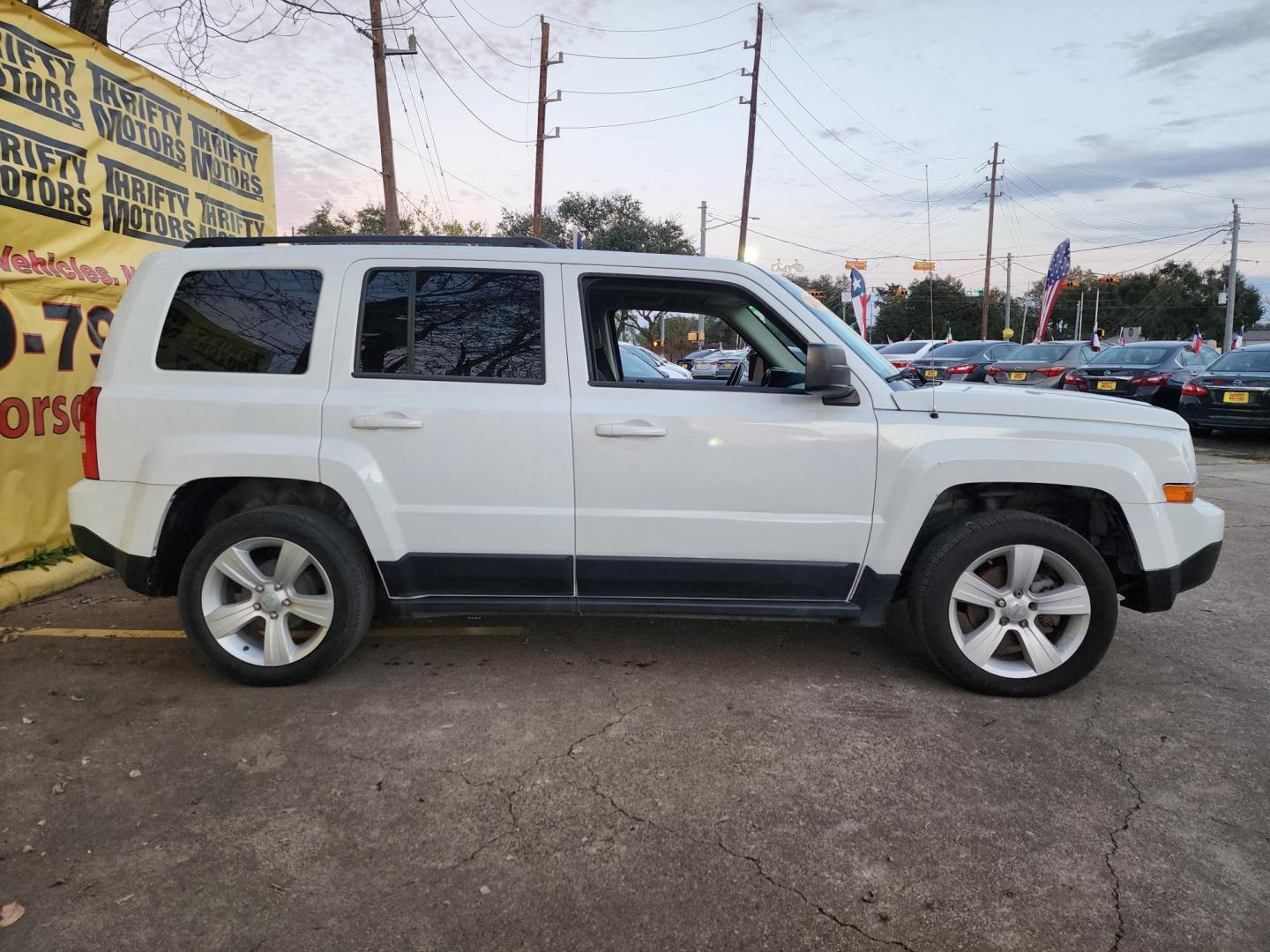 2016 White /Gray Jeep Patriot Latitude 2WD (1C4NJPFBXGD) with an 2.4L L4 DOHC 16V engine, located at 16710 Clay Rd., Houston, TX, 77084, (281) 859-7900, 29.834864, -95.656166 - Photo#3