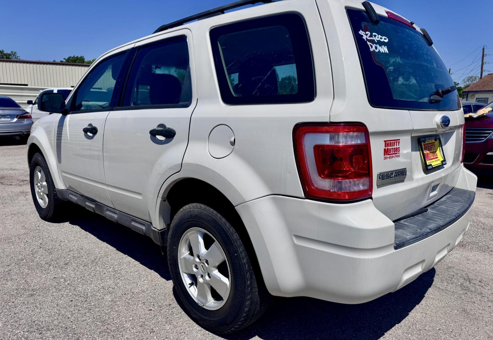 2012 White Ford Escape XLS FWD (1FMCU0C78CK) with an 2.5L L4 DOHC 16V engine, Automatic transmission, located at 16710 Clay Rd., Houston, TX, 77084, (281) 859-7900, 29.834864, -95.656166 - Photo#2