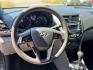 2017 Hyundai Accent SE 4-Door 6M (KMHCT4AE2HU) with an 1.6L L4 DOHC 16V engine, 6M transmission, located at 16710 Clay Rd., Houston, TX, 77084, (281) 859-7900, 29.834864, -95.656166 - Photo#4