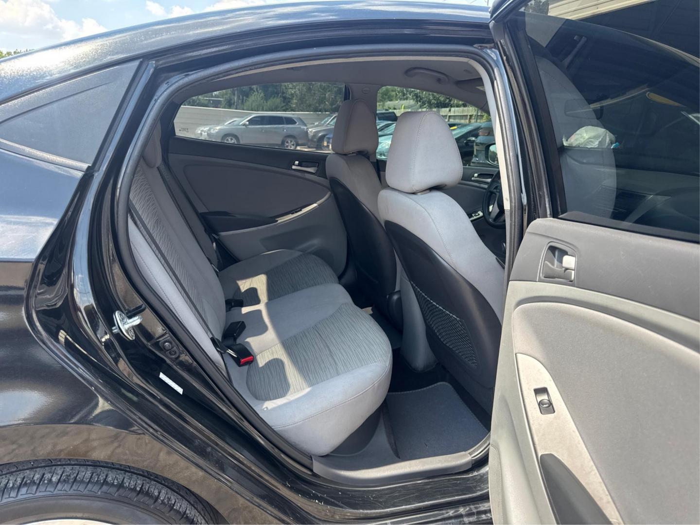 2017 Hyundai Accent SE 4-Door 6M (KMHCT4AE2HU) with an 1.6L L4 DOHC 16V engine, 6M transmission, located at 16710 Clay Rd., Houston, TX, 77084, (281) 859-7900, 29.834864, -95.656166 - Photo#9