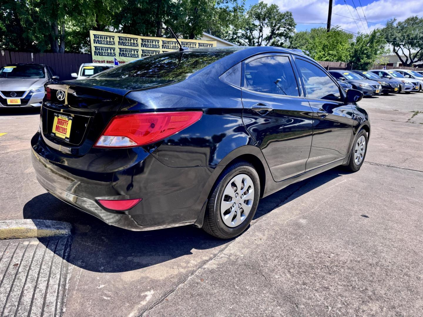2016 Black /Gray Hyundai Accent SE 4-Door 6A (KMHCT4AE9GU) with an 1.6L L4 DOHC 16V engine, 6A transmission, located at 16710 Clay Rd., Houston, TX, 77084, (281) 859-7900, 29.834864, -95.656166 - Photo#2