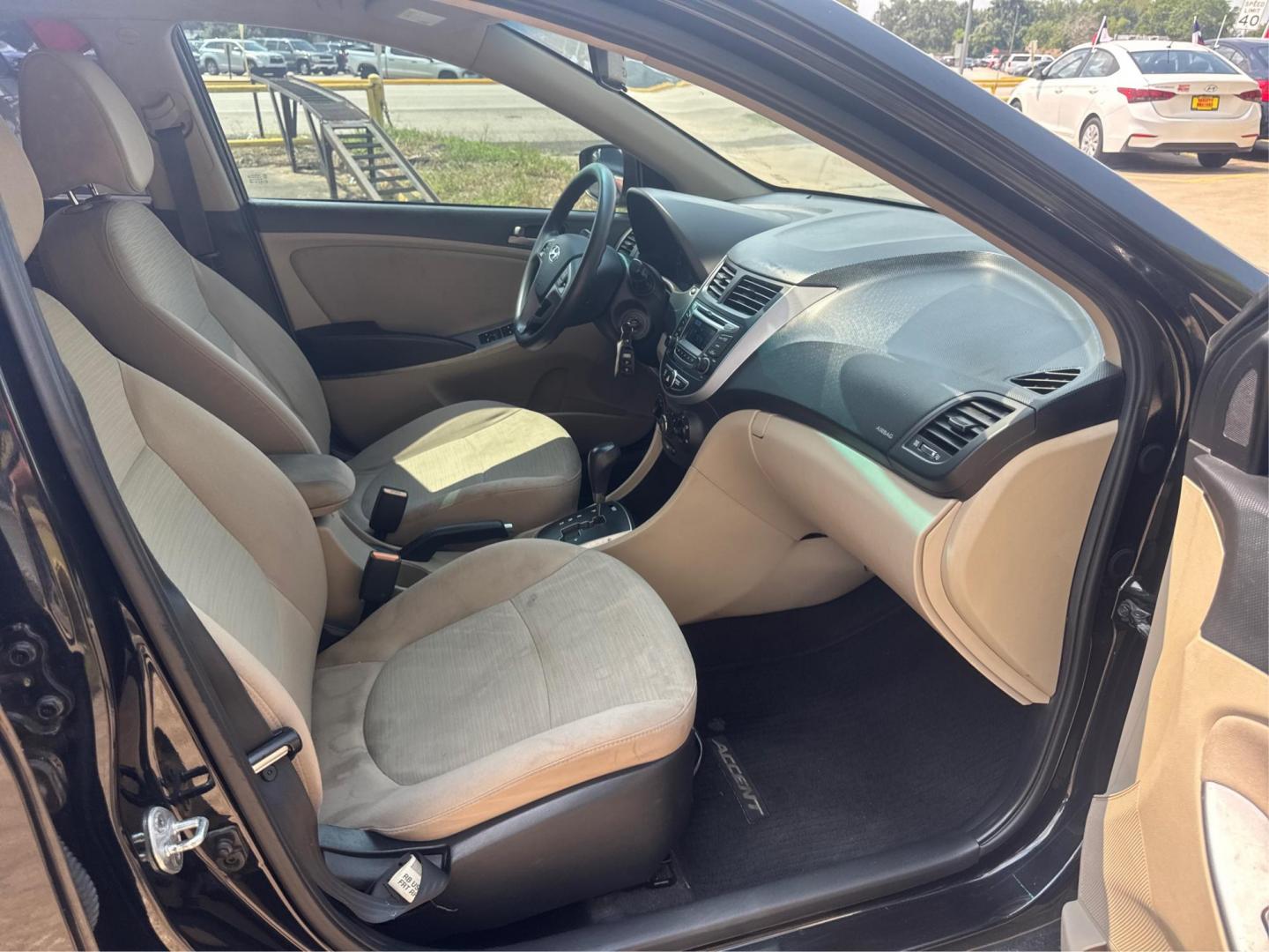 2016 Black /Gray Hyundai Accent SE 4-Door 6A (KMHCT4AE9GU) with an 1.6L L4 DOHC 16V engine, 6A transmission, located at 16710 Clay Rd., Houston, TX, 77084, (281) 859-7900, 29.834864, -95.656166 - Photo#11
