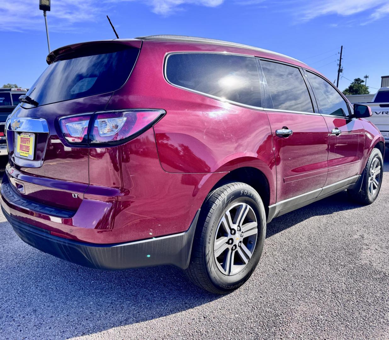 2017 Red /Gray Chevrolet Traverse 1LT FWD (1GNKRGKD7HJ) with an 3.6L V6 DOHC 24V engine, 6A transmission, located at 16710 Clay Rd., Houston, TX, 77084, (281) 859-7900, 29.834864, -95.656166 - Photo#1