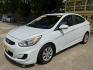 2017 White /Gray Hyundai Accent SE 4-Door 6M (KMHCT4AE7HU) with an 1.6L L4 DOHC 16V engine, 6M transmission, located at 16710 Clay Rd., Houston, TX, 77084, (281) 859-7900, 29.834864, -95.656166 - Photo#7