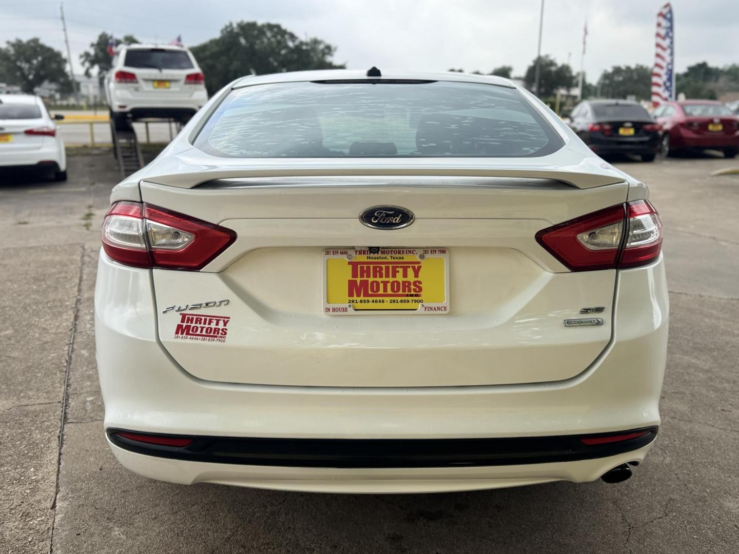 2015 White /Black Ford Fusion SE (1FA6P0HD8F5) with an 1.5L L4 DOHC 16V engine, located at 16710 Clay Rd., Houston, TX, 77084, (281) 859-7900, 29.834864, -95.656166 - Photo#4