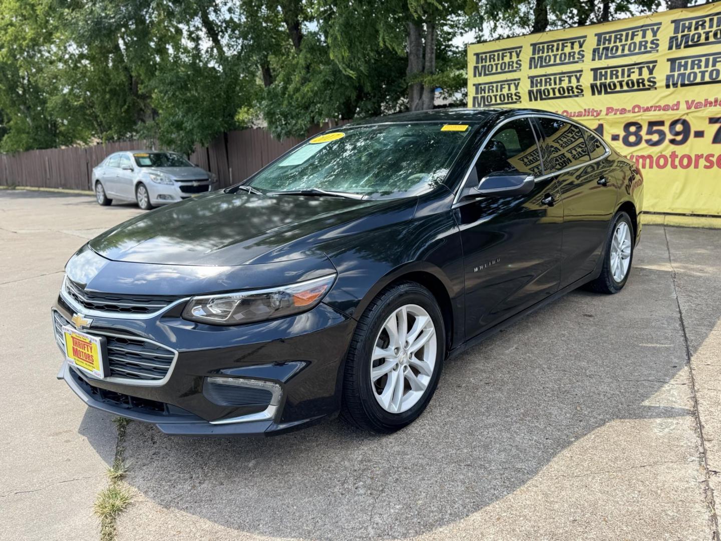 2017 Black /Black Chevrolet Malibu 1LT (1G1ZE5ST9HF) with an 1.5L L4 DOHC 16V engine, 6A transmission, located at 16710 Clay Rd., Houston, TX, 77084, (281) 859-7900, 29.834864, -95.656166 - Photo#1