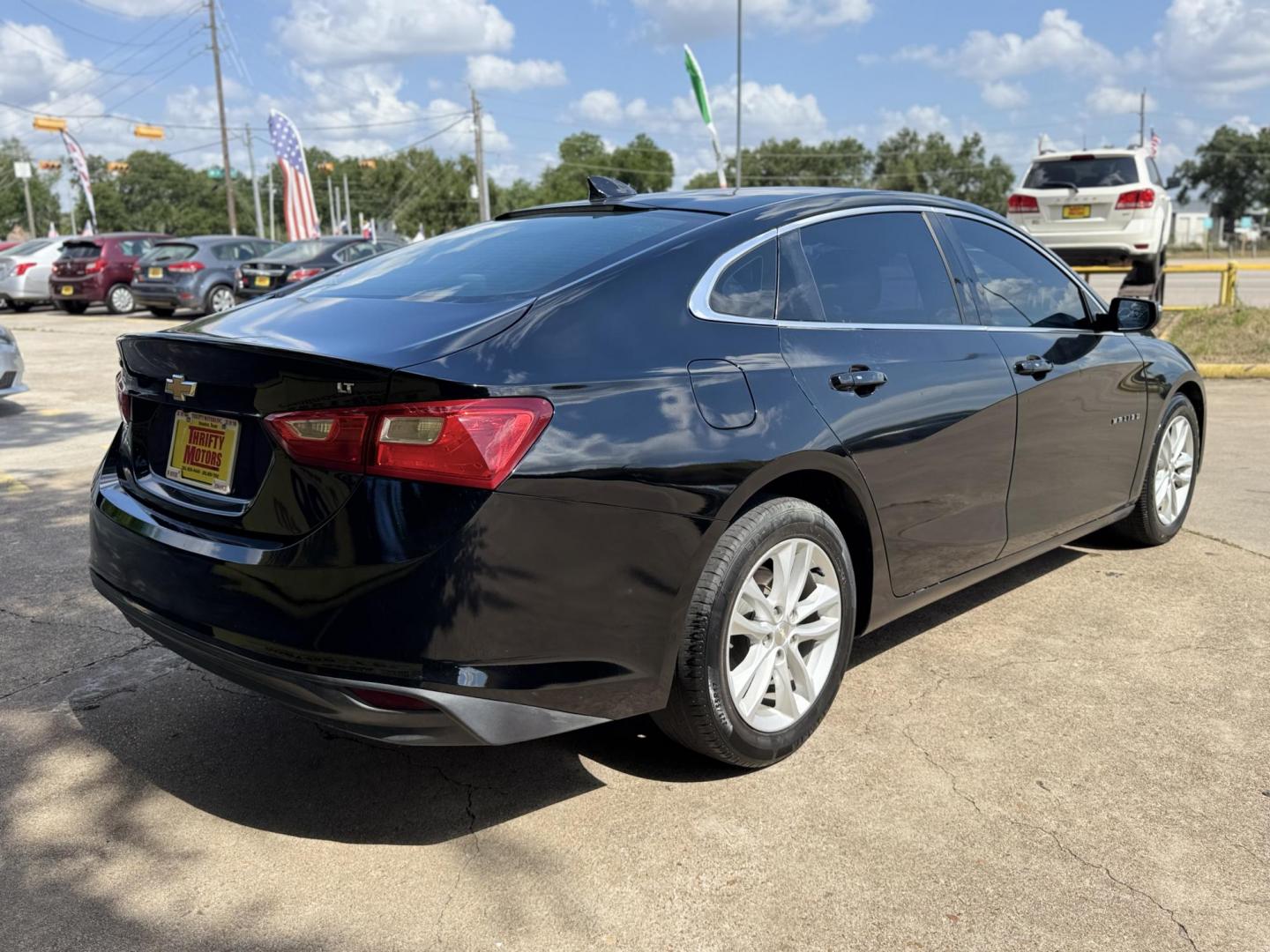 2017 Black /Black Chevrolet Malibu 1LT (1G1ZE5ST9HF) with an 1.5L L4 DOHC 16V engine, 6A transmission, located at 16710 Clay Rd., Houston, TX, 77084, (281) 859-7900, 29.834864, -95.656166 - Photo#3