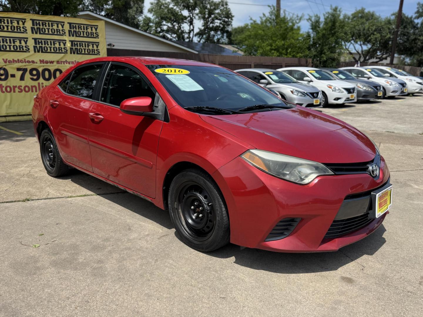 2016 Red /Silver Toyota Corolla L 4-Speed AT (2T1BURHE0GC) with an 1.8L L4 DOHC 16V engine, 4A transmission, located at 16710 Clay Rd., Houston, TX, 77084, (281) 859-7900, 29.834864, -95.656166 - Photo#2