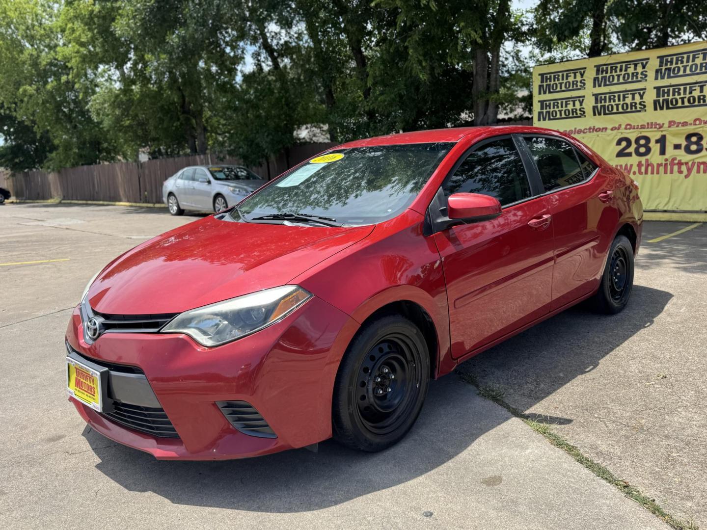 2016 Red /Silver Toyota Corolla L 4-Speed AT (2T1BURHE0GC) with an 1.8L L4 DOHC 16V engine, 4A transmission, located at 16710 Clay Rd., Houston, TX, 77084, (281) 859-7900, 29.834864, -95.656166 - Photo#1