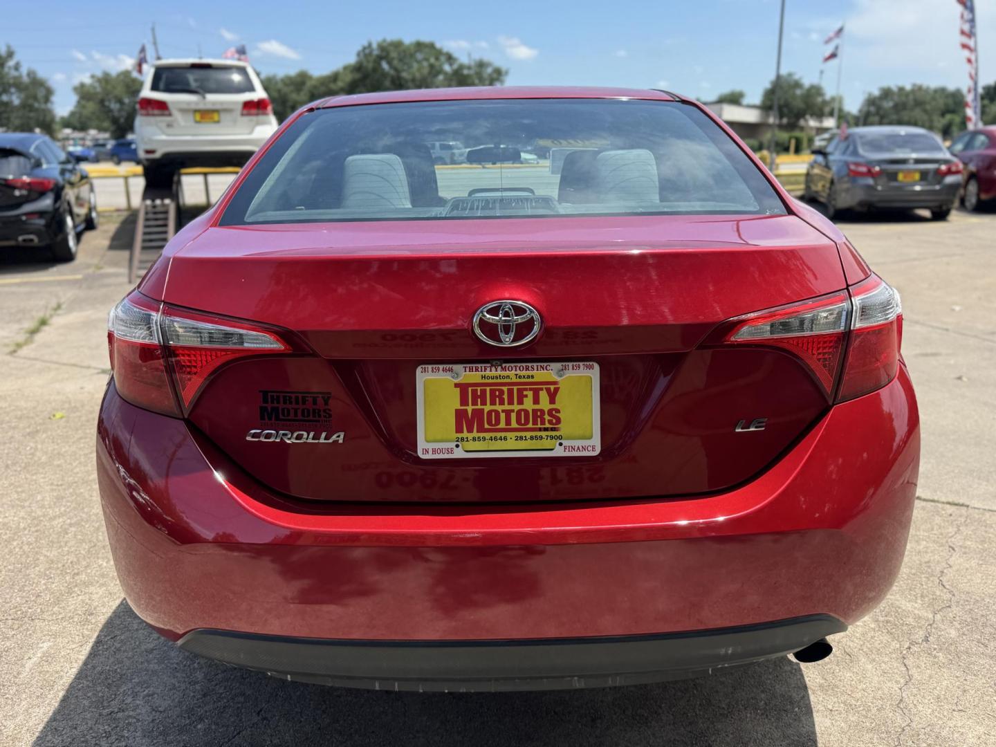 2016 Red /Silver Toyota Corolla L 4-Speed AT (2T1BURHE0GC) with an 1.8L L4 DOHC 16V engine, 4A transmission, located at 16710 Clay Rd., Houston, TX, 77084, (281) 859-7900, 29.834864, -95.656166 - Photo#5