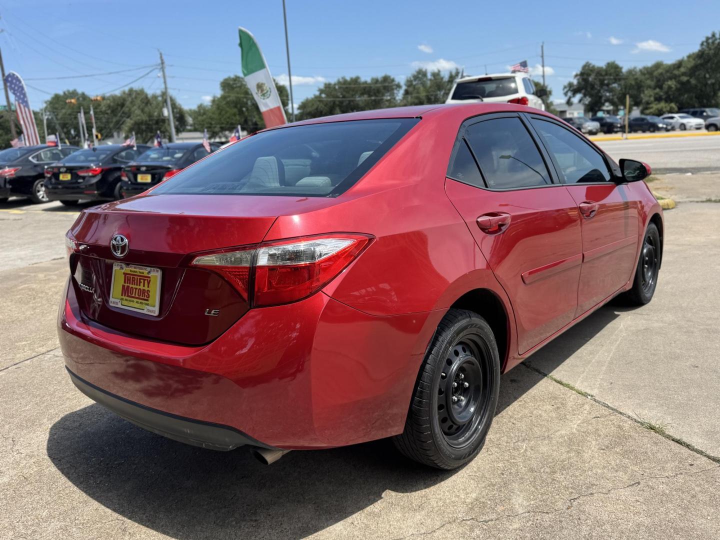 2016 Red /Silver Toyota Corolla L 4-Speed AT (2T1BURHE0GC) with an 1.8L L4 DOHC 16V engine, 4A transmission, located at 16710 Clay Rd., Houston, TX, 77084, (281) 859-7900, 29.834864, -95.656166 - Photo#4