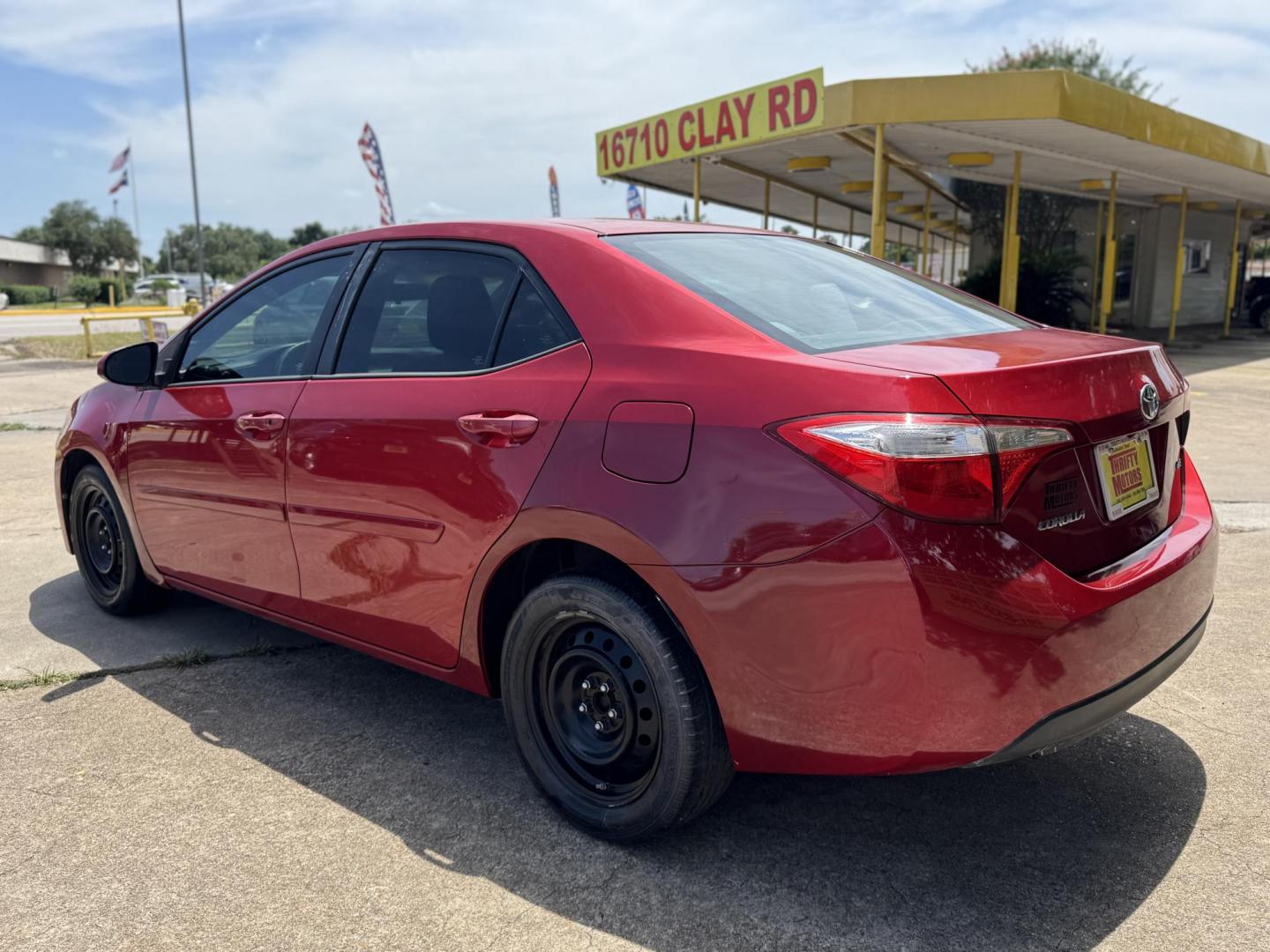 2016 Red /Silver Toyota Corolla L 4-Speed AT (2T1BURHE0GC) with an 1.8L L4 DOHC 16V engine, 4A transmission, located at 16710 Clay Rd., Houston, TX, 77084, (281) 859-7900, 29.834864, -95.656166 - Photo#7