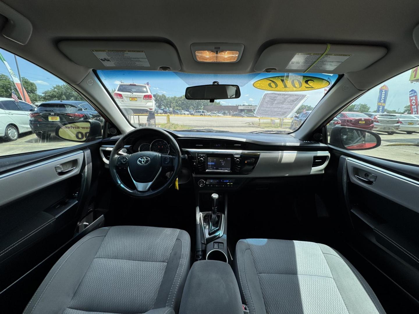 2016 Red /Silver Toyota Corolla L 4-Speed AT (2T1BURHE0GC) with an 1.8L L4 DOHC 16V engine, 4A transmission, located at 16710 Clay Rd., Houston, TX, 77084, (281) 859-7900, 29.834864, -95.656166 - Photo#14