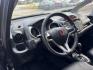 2011 Gray /Black Honda Fit Sport 5-Speed AT (JHMGE8H52BC) with an 1.5L L4 SOHC 16V engine, 5-Speed Automatic transmission, located at 16710 Clay Rd., Houston, TX, 77084, (281) 859-7900, 29.834864, -95.656166 - Photo#9